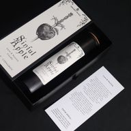 Картка ритуального закляття «Гріхове яблуко» біля свічки